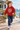 Four-year-old in red hoodie outside a seaside café