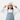 Girl in white beanie peace sign