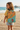 Girl in yellow tee on beach boardwalk