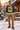 Green ski sweater at a chalet