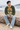 Green ski sweater on a sandy beach