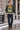 Green ski sweater on a winter city street