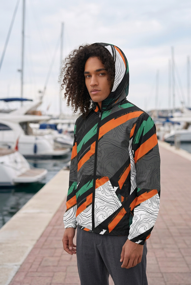 Hood-up jacket portrait at a marina