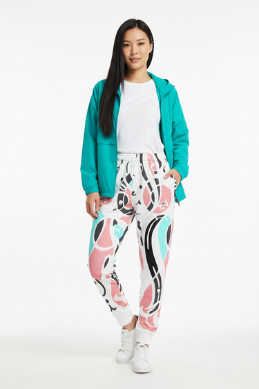 Model wearing Abstract Chain Recycled Joggers with turquoise windbreaker