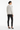 Back view of sweater styled with black leather pants