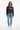 Abstract burst sweater styled casually with light wash denim and white sneakers
