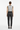Back view of geometric hearts vest with dark trousers