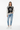 Artistic palm sweater styled casually with light wash denim and white sneakers
