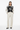 Artistic palm sweater with wide-leg trousers for smart-casual look