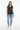 Geometric hearts vest styled casually with light wash denim and white sneakers
