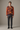 Leaf-print sweater in a minimalist studio
