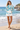 Look 1: female model, beach, white shorts