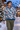 Look 4: male model, snowy village street