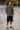 Loose black denim shorts at a skatepark