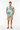 Male model in beige chino shorts and brown leather sandals