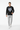 Male model in black sweatshirt with gray joggers