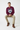 Male model in burgundy sweatshirt with khaki chino pants sitting