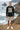 Male model in charcoal mountain graphic tee and stone shorts