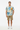 Male model in khaki shorts and white sneakers