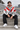 Male model seated in a circuit grandstand