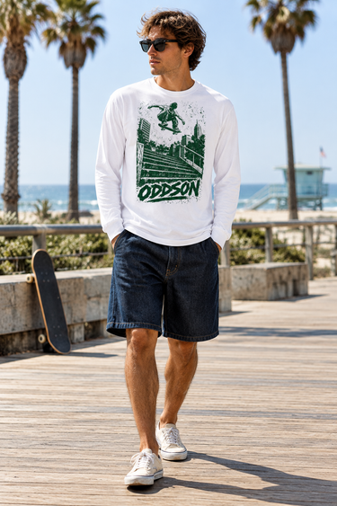 Male model wearing the ODDSON long-sleeve tee on a boardwalk