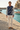 Male sweater editorial with ivory linen pants