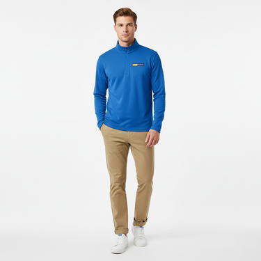 Man with short hair in atomic blue lightweight quarter-zip pullover with khaki chinos