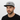 Man with stubble in gray snapback