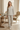 Matching botanical pajama set in a villa breakfast nook