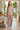Matching floral pajama set in a breakfast nook