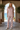 Matching floral pajama set on a shaded terrace