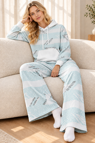 Matching pale-blue hoodie and wide-leg joggers in a cozy sofa look