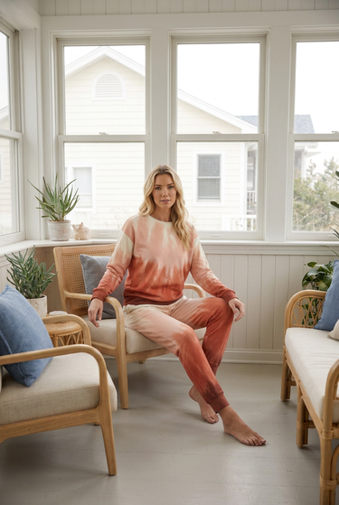 Matching sunset crewneck and joggers in coastal sunroom