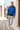 Mediterranean alley editorial with light grey joggers
