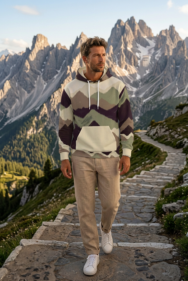 Mountain-print hoodie styled on an alpine trail