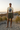 Natural shirt with olive utility shorts on a rocky beach