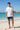 Navy boardshorts white tee beach
