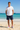 Navy boardshorts white tee beach