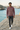 New male model walking the coastal promenade