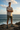 Olive boardshorts coastal cliff
