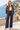 Open floral bomber styled with navy tailored trousers