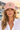 Peachy cap on female model