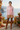Pink hoodie with camel winter shorts