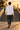 Rear view of the plain white ODDSON long-sleeve tee