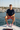 Red boardshorts navy tee yacht