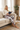 Rose-camo leggings and ivory sweatshirt, sofa reading look