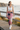 Rose-print leggings coastal boardwalk editorial
