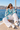 Sailboat: Santorini brunette woman