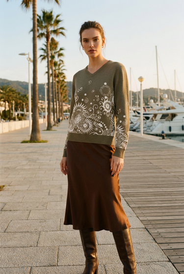 Sweater styled with a chocolate satin skirt