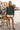 Sweatshirt with cream shorts and heels